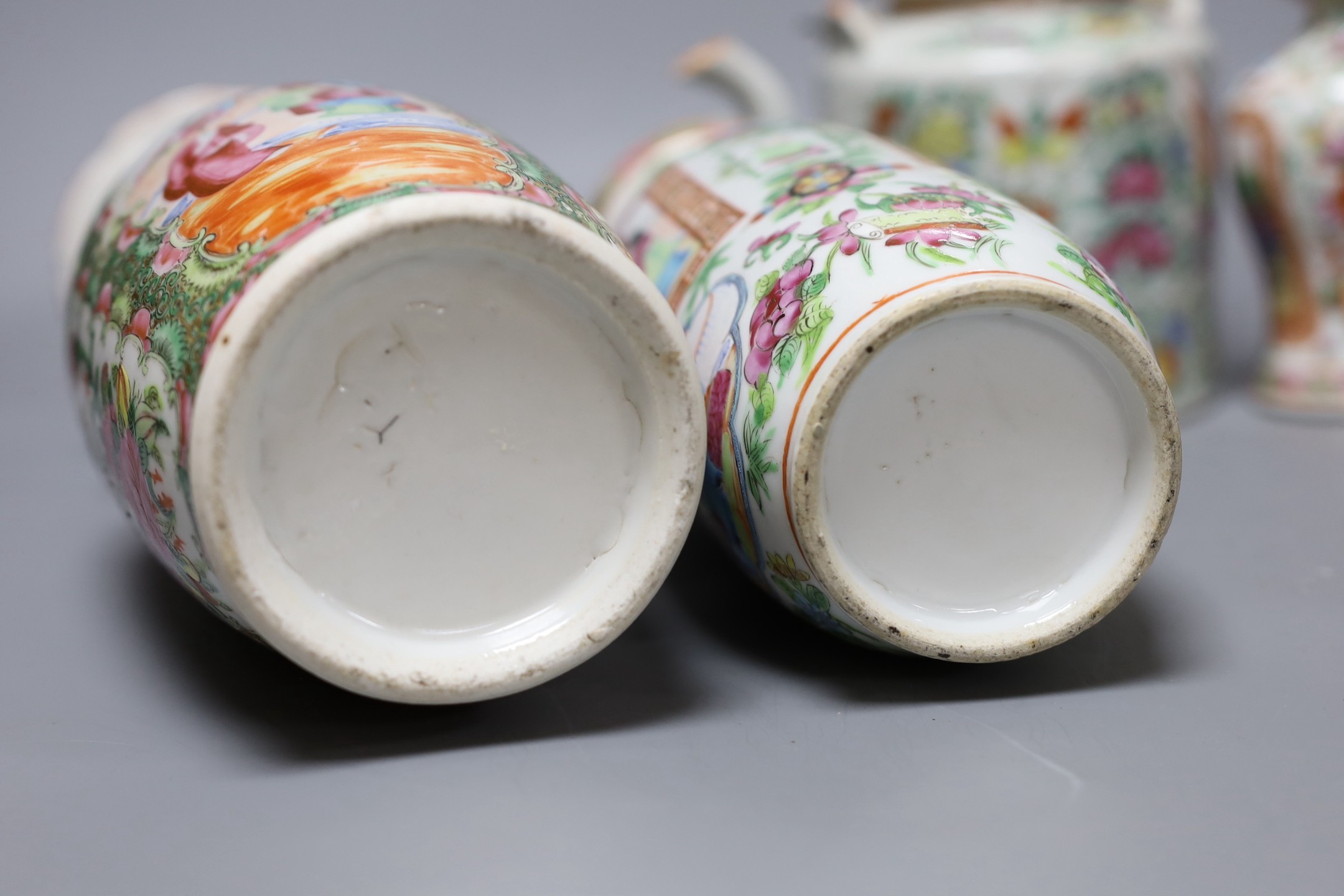 Three Chinese famille rose vases and a teapot, late 19th/early 20th century, tallest vase 29.5 cms high